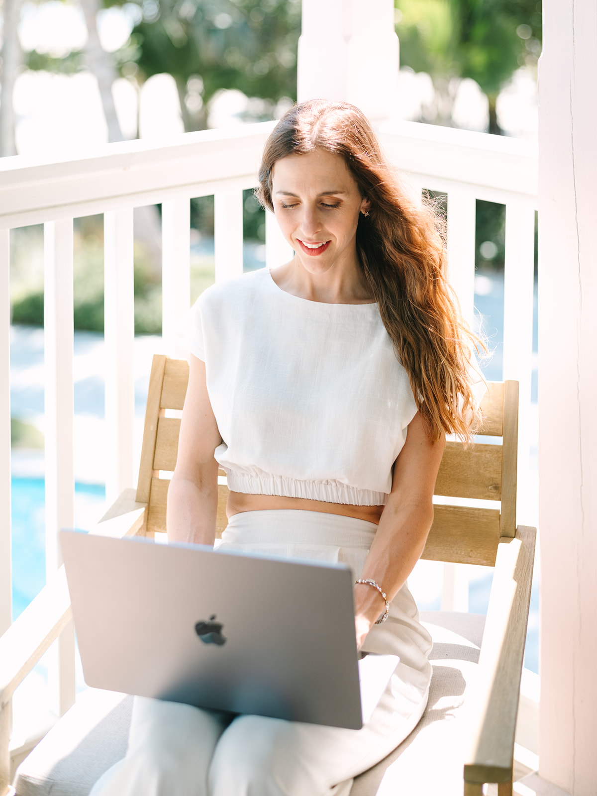 Entrepreneur working on laptop with strategic planning documents and coffee, representing DIY marketing resources for growing businesses